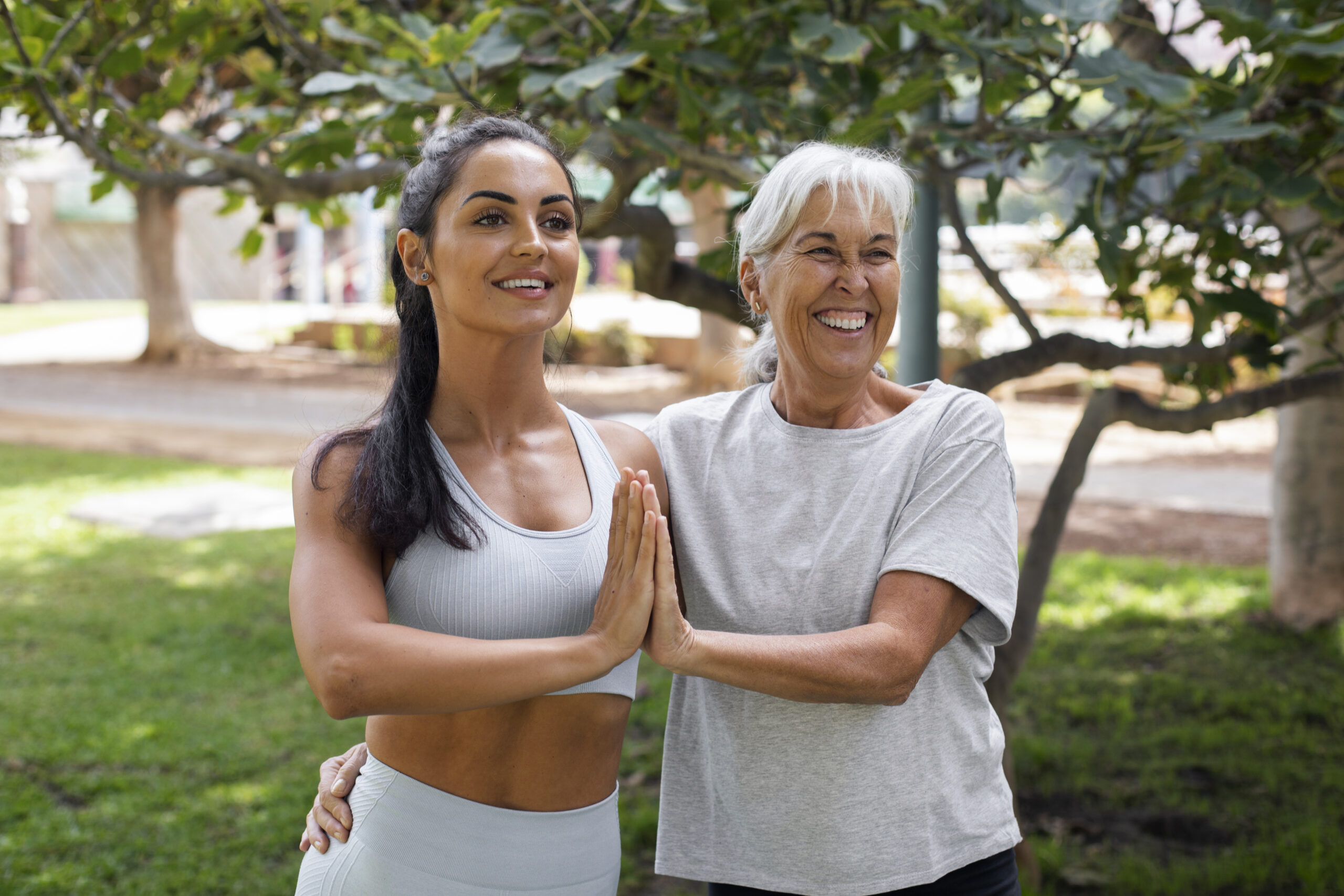 friends doing yoga together park